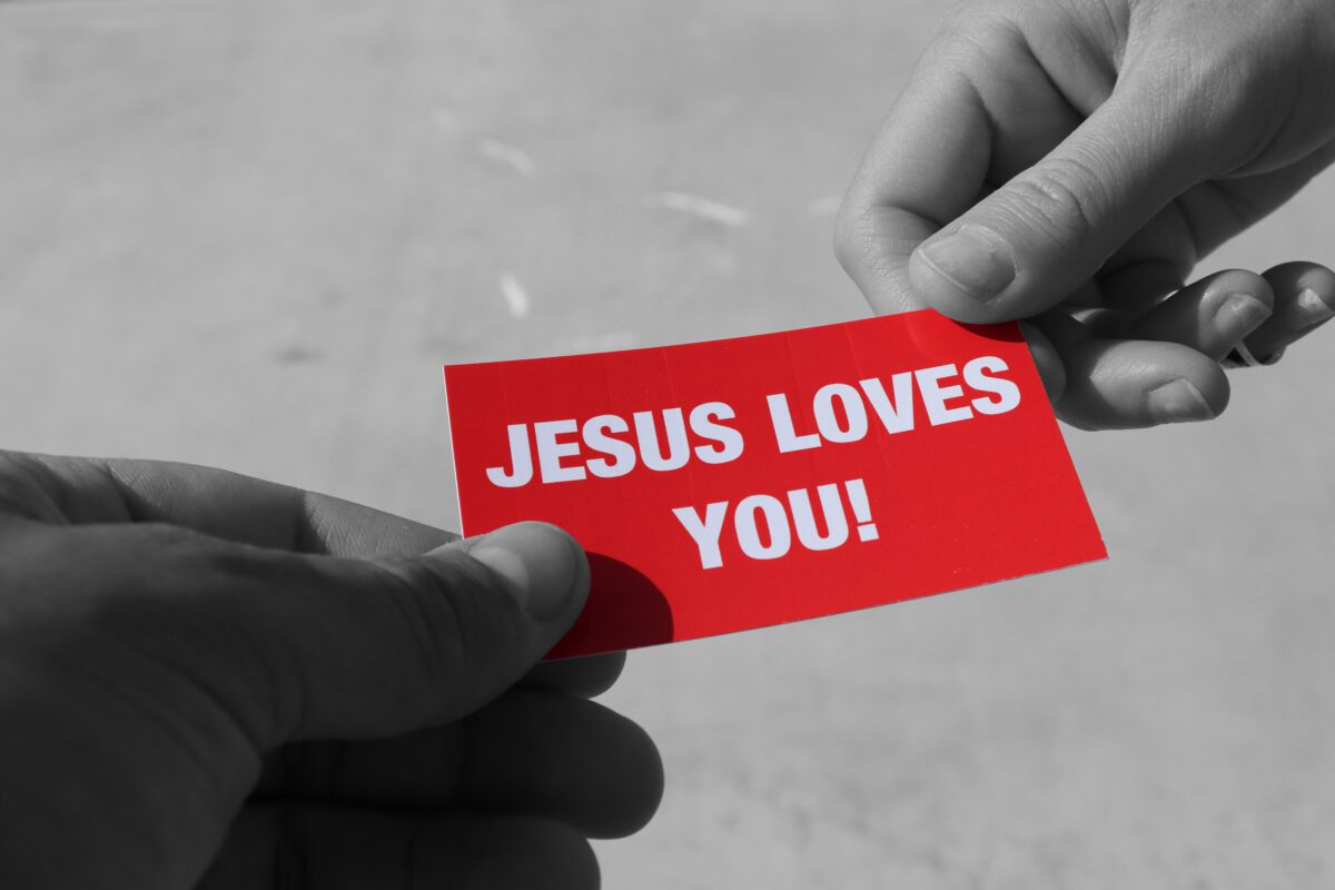 Jesus Loves You Gospel Tract Being Handed Out